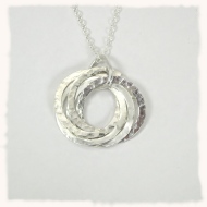 Five ring silver pendant